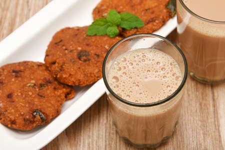 Parippu vada with Indian milk tea or Chai Kerala Snacks popular deep fried hot and spicy tea time food. Traditional food for Ramadan, Onam, Vishu in tamil nadu, Street food of India.の写真素材