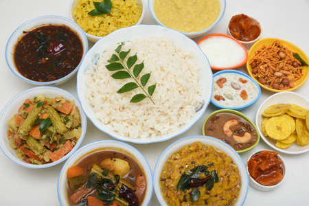 Onam Sadhya, traditional Indian lunch boiled rice served with many spicy hot curries and lots of sweet dessert for Kerala harvest festival in India.の写真素材