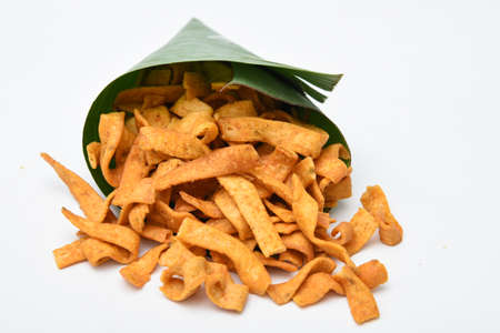 Kerala snack Pakkavada or ribbon Pakoda fried snack popular in South India Tamil Nadu, Top view Indian tea time food fried in coconut oil.の写真素材