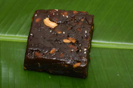 Indian sweet dessert, black Halwa with rice, Halva, halawa, aluva sweet confections in South Asia, Kerala, India. slightly gelatinous and made from grain flour, typically semolina. Indian mithaiの写真素材