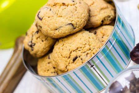 Dog treats spilling out of bowl. Dog treats and biscuitsの写真素材