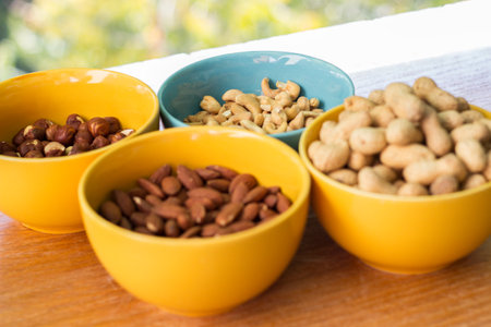 Assortment of mixed nuts on wood table background. Healthy nutsの写真素材