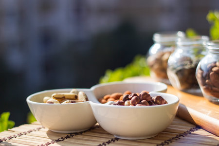 Nuts and seeds. Superfoods in Bowls on Wooden Backgroundの写真素材