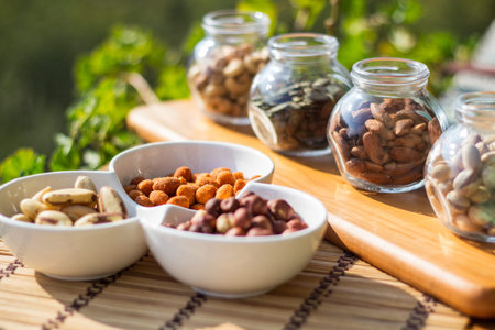 Nuts and seeds. Superfoods in Bowls on Wooden Background