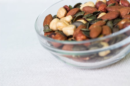 Bowl full of walnuts, hazelnuts, brazil nuts, and almondsの写真素材