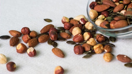 Bowl full of walnuts, hazelnuts, brazil nuts, and almonds