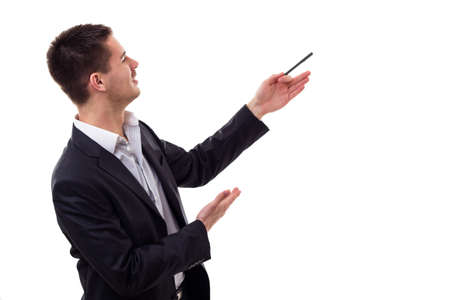 Young businessman holding pen in hand and presenting. Isolated on whiteの写真素材