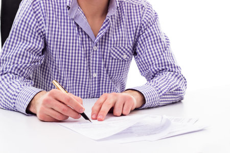 Businessman with fountain pen signing contract