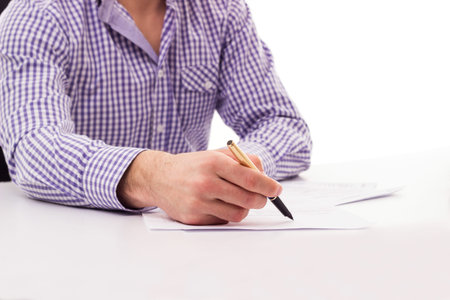 Businessman with fountain pen signing contractの写真素材