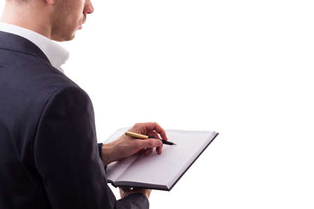 Businessman's hand writing with fountain pen , isolated on whiteの写真素材