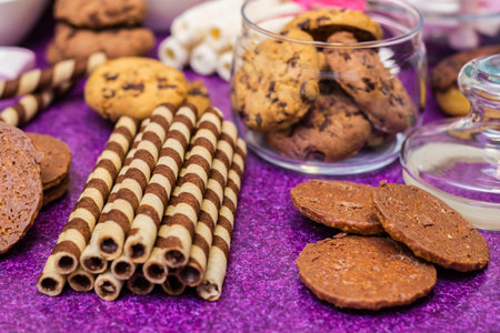 Chocolate and biscuits background. Chocolate and biscuits background. Many pieces of chocolate,...