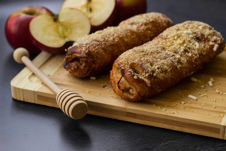 Homemade pastry strudel with apple and walnutsの写真素材