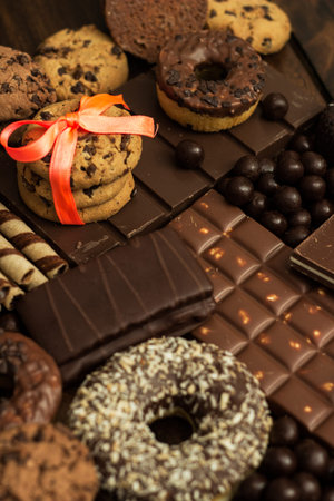 Dark and milk chocolate products and biscuits