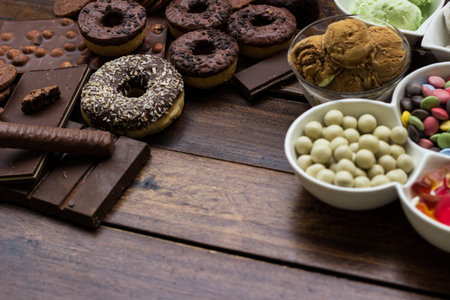 Rustic table of sweets and ice cream.  Colorful candies background