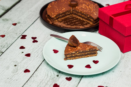 Chocolate almond cake with gift for Valentine's Dayの写真素材