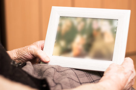 Grandmother with memories from pastの写真素材