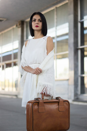 <p>Young woman in railway station waiting for a train</p>の写真素材