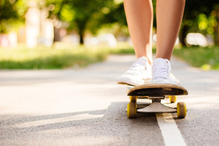 Speeding skateboarding legs, the basketball courtの写真素材