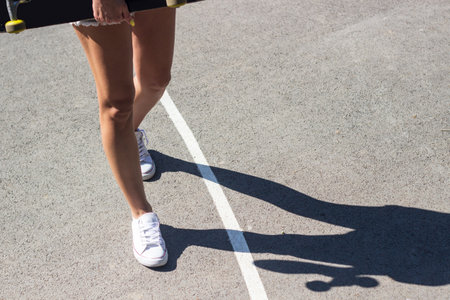 Speeding skateboarding legs, the basketball courtの写真素材