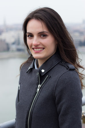 Beauty portrait of a young brunette woman with beautiful smile, outdoorsの写真素材