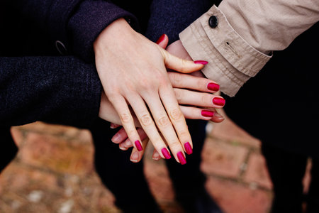 Group with hands together, friendshipの写真素材