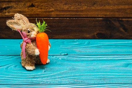 Easter bunny on wooden wall with copy spaceの写真素材