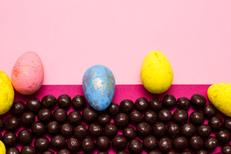 Chocolate and Easter Eggs on color Background. Happy Easterの写真素材