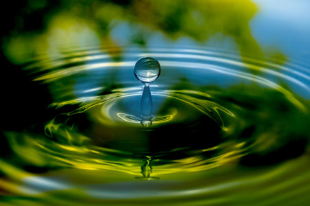 Rain splashing into a pond in the fall