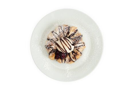 Cheesecake with apple on a white background, chocolate watering.の写真素材