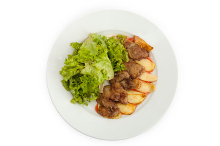 Fried meat, herbs, sauces, potatoes, on a wooden boardの写真素材