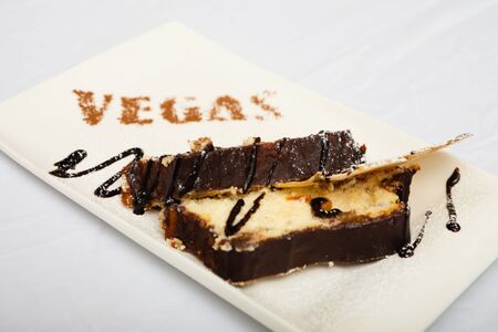 Cheesecake with apple on a white background, chocolate watering, photo for restaurant menuの写真素材