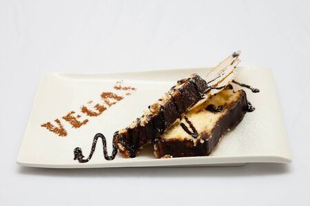 Cheesecake with apple on a white background, chocolate watering, photo for restaurant menuの写真素材