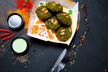 Indian food on a dark background, in paper utensils, photos for menus and advertising. Additives and spicy spices.の写真素材