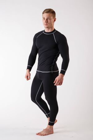 The guy in thermal underwear on a white background. Sportswear.の写真素材