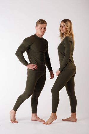 Guy and girl in thermal underwear on a white backgroundの写真素材