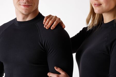 Guy and girl in thermal underwear on a white backgroundの写真素材