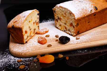 Sweet cupcake in the shape of bread. Cupcake with raisins, dried apricots, plums.の写真素材