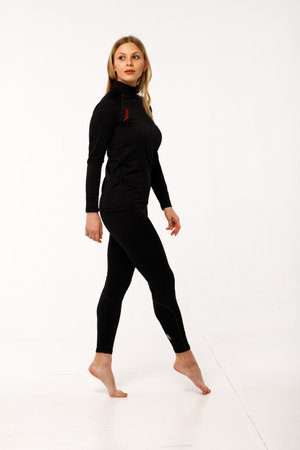 Sporty blonde girl in thermal clothing for womenの写真素材