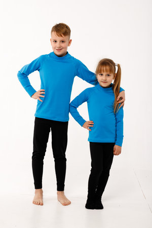 A little girl and her older brother in thermal clothes.の写真素材