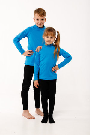 A little girl and her older brother in thermal clothes.の写真素材