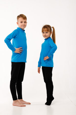 A little girl and her older brother in thermal clothes.の写真素材