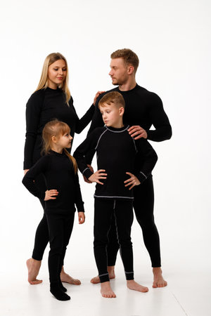 Sports family in thermal clothes, on a white background.の写真素材