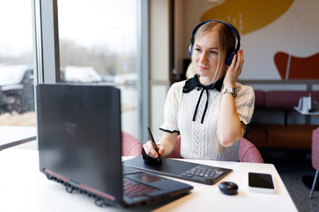 The girl works and studies with a graphic tabletの写真素材