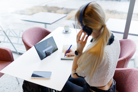 Businesswoman Yulia works remotely in a cafeの写真素材
