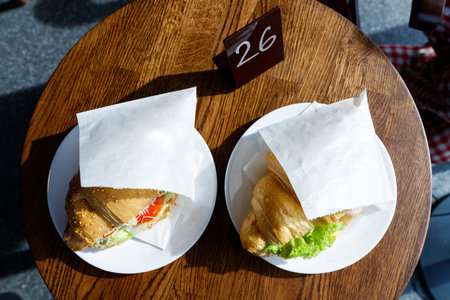 Appetizing croissants with coffee in a coffee shop.の写真素材