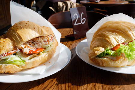 Appetizing croissants with coffee in a coffee shop.の写真素材