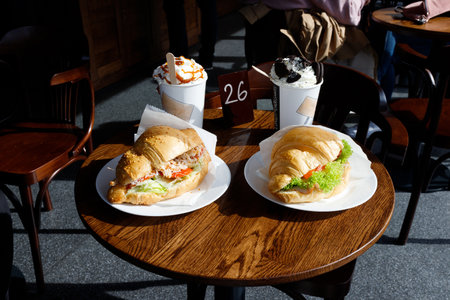Appetizing croissants with coffee in a coffee shop.の写真素材