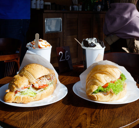 Appetizing croissants with coffee in a coffee shop.の写真素材