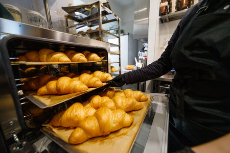Croissants straight from the oven after baking.の写真素材