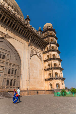 Vijaypura, India - February 15, 2019: Young indian couple visit the UNESCO World Heritage Site, Gol Gumbaz at Vijaypura, Karnataka, India.のeditorial素材